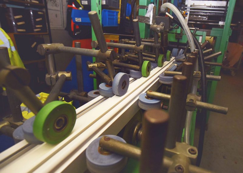 The woodgrain foil is bonded to the PVC profile using hot glue and rollers at our Brighouse facility, ensuring durability and quality