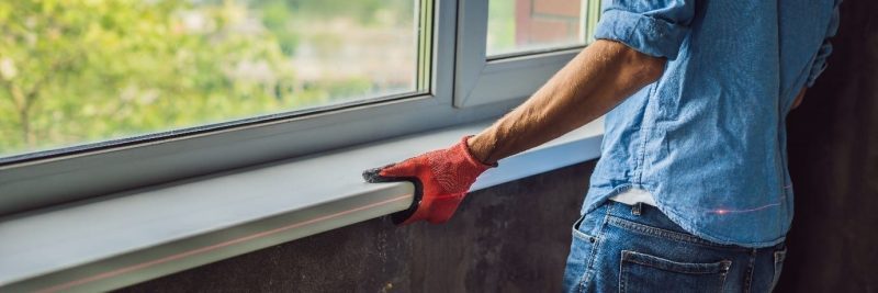 installer fitting new uPVC white casement windows