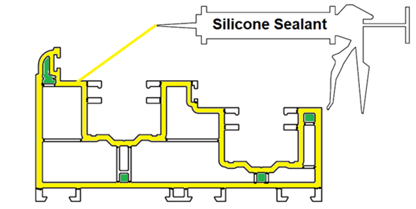 Silicone sealant applied to bottom of frame jambs, covering yellow-highlighted areas