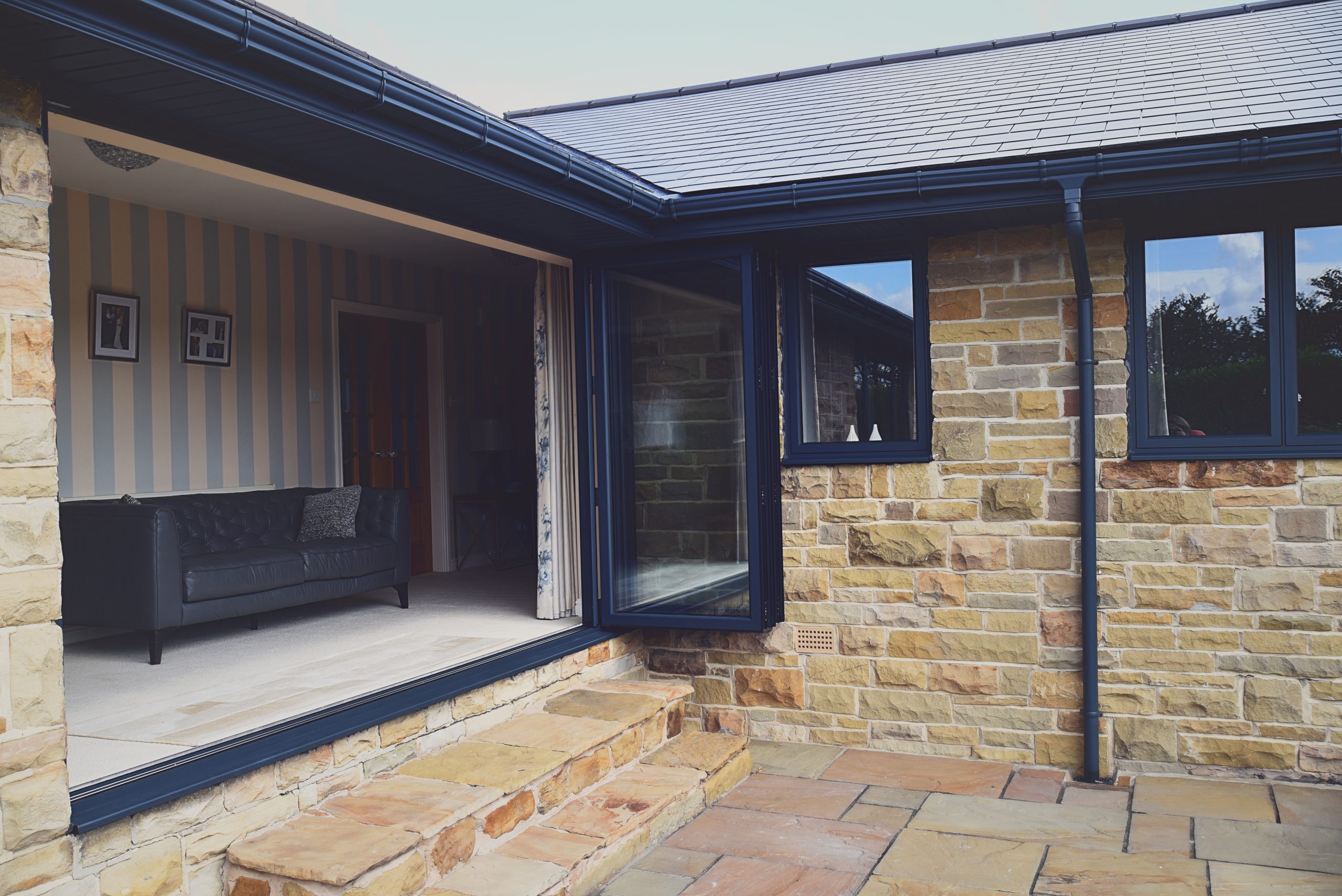 Quickslide helps Wendy with a custom triangular window in her kitchen diner, using aluminium frames for more light