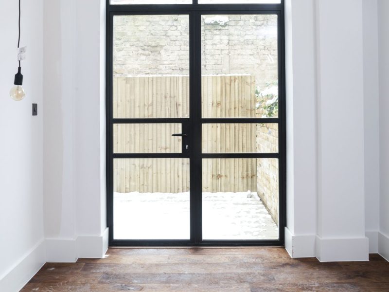 Aluminium heritage doors in Art Deco configurations featuring horizontal glazing bars and period style
