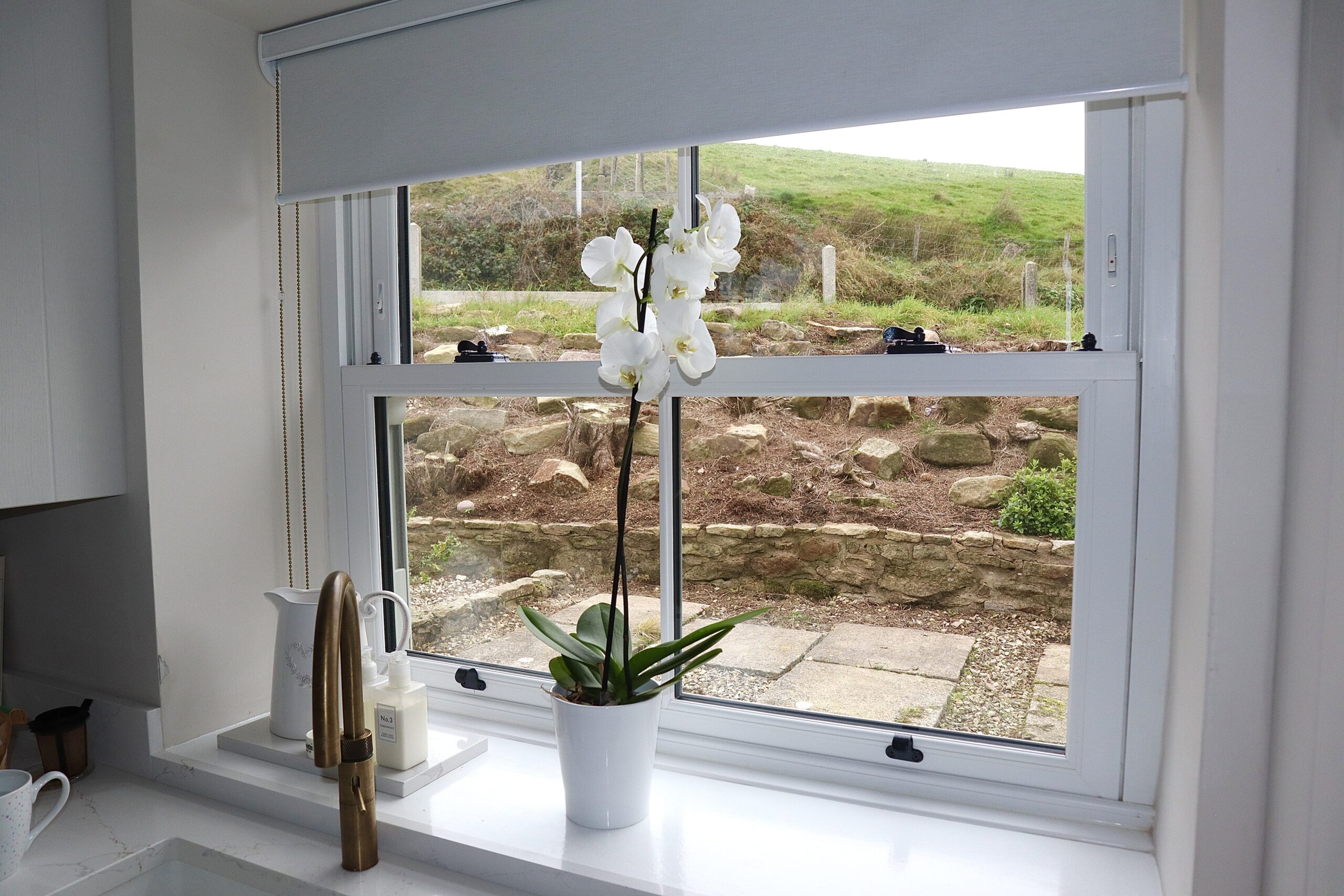 Woodgrain agate grey sliding sash windows replicating traditional timber aesthetics