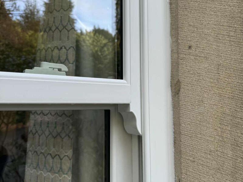 Smooth white sliding sash windows enhancing a period building while improving performance