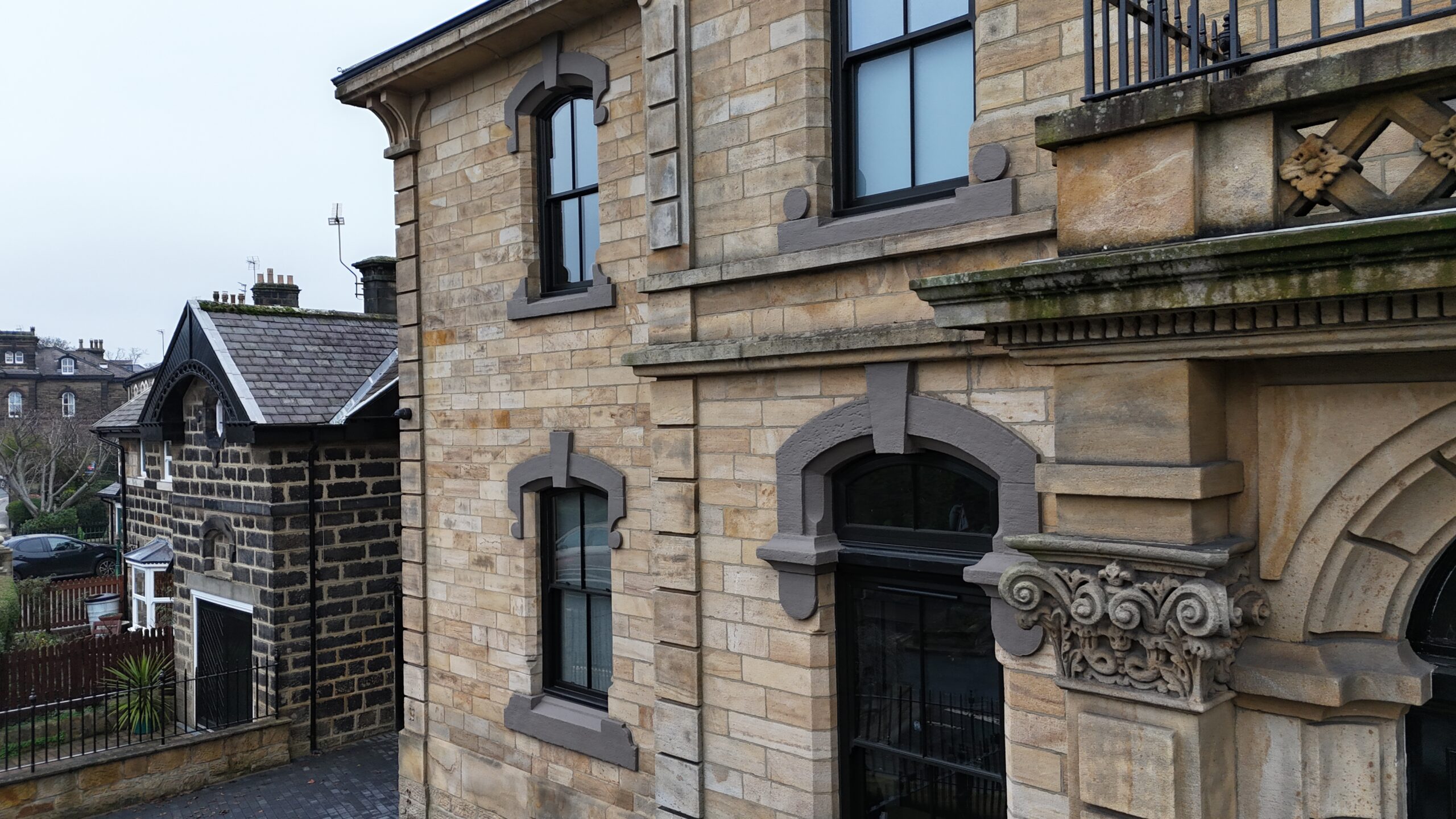 Period home upgraded with black woodgrain sliding sash windows