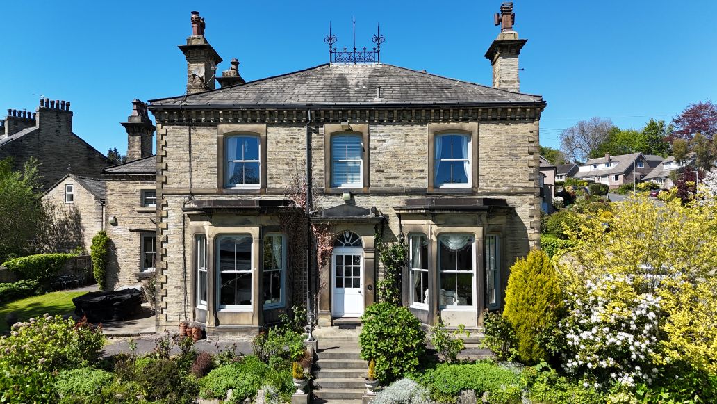 Authentic white uPVC sash windows fitted to a traditional stone period property