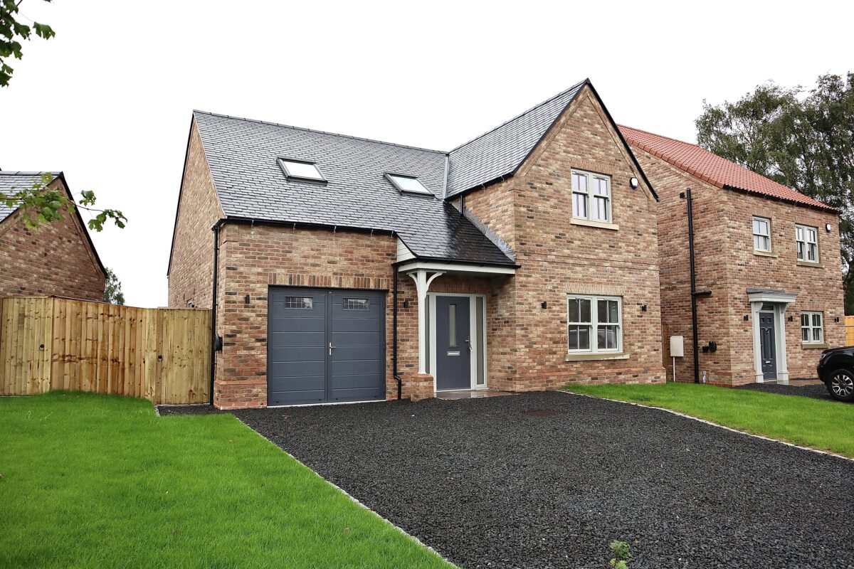 New build home with heritage-style uPVC sash windows and traditional glazing bars